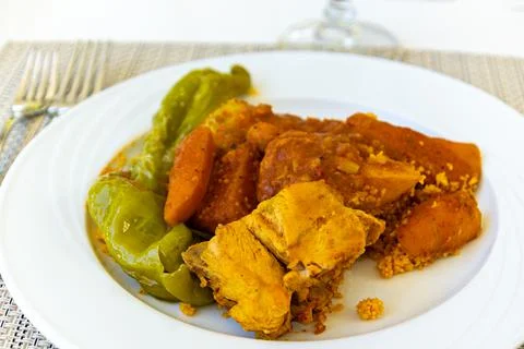 Plate of couscous with chicken on a table Stock Photos