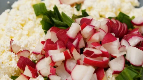 Plate of cream cheese with radish and chive. Vegetarian food. 4K Stock Footage