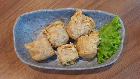 Plate of Crispy Deep Fried Tofu Bites Appetizer with Lettuce Stock Photos