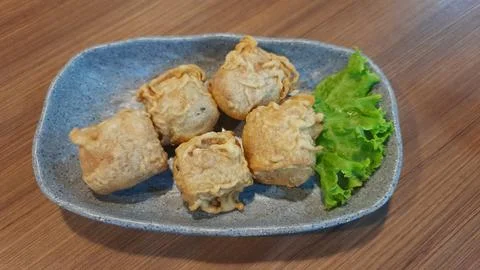 Plate of Crispy Deep Fried Tofu Bites Appetizer with Lettuce Stock Photos