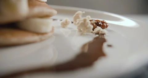 On the plate in the cupcakes throw ice cream pieces in slow motion in 4k Stock Footage 101199224