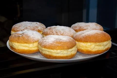 Plate with custard buns Stock Photos
