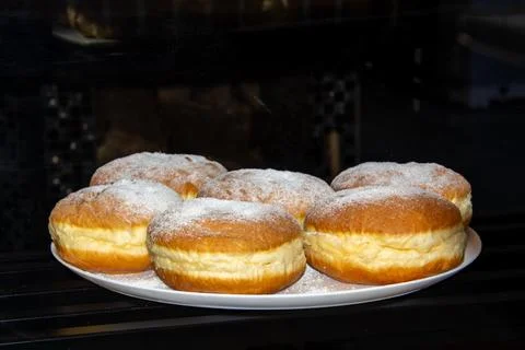 Plate with custard buns Stock Photos
