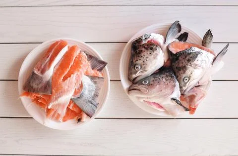A plate of cutted raw red fish for preparing soup Stock Photos