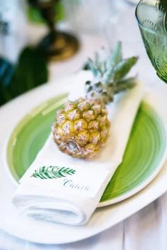 Plate decorated with a pineapple and decor, green and white colour 스톡 사진