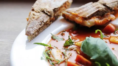 Plate of delicious gazpacho soup at restaurant Stock Footage