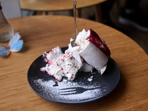 A plate of dessert with a fork in it Stock Photos
