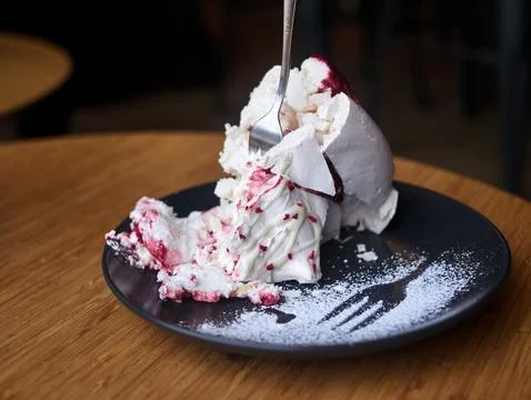 A plate of dessert with a fork in it Stock Photos