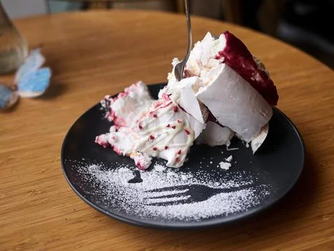 A plate of dessert with a fork in it Stock Photos