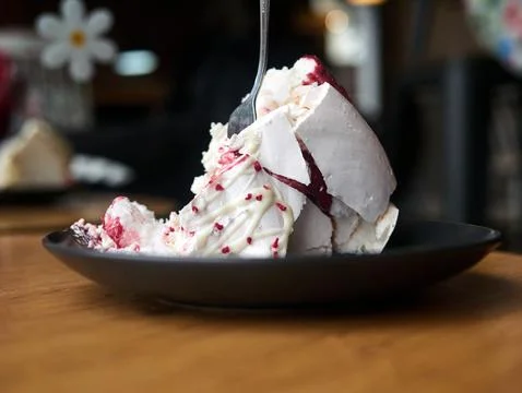 A plate of dessert with a fork in it Stock Photos