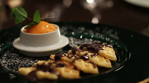A plate with a dessert, ice-cream and waffles. Stock Footage 63395830
