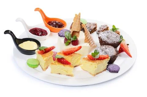 Plate of different desserts isolated Stock Photos