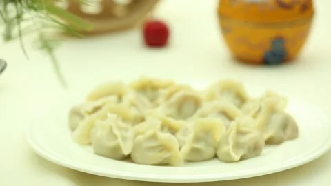 A plate of dumplings on the table (3) Stock Footage 202158689
