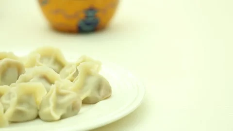 A plate of dumplings on the table (4) Stock Footage 202158692