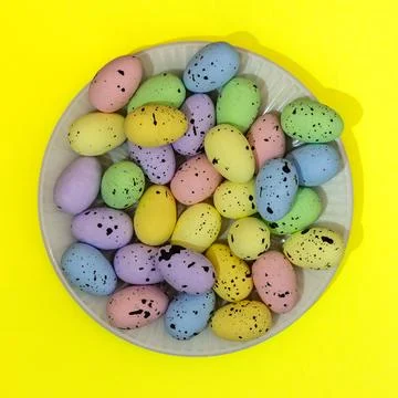 A plate of Easter eggs with different colors and sizes Stock Photos