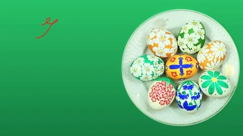 A plate with Easter eggs rotates, and above it appears the text "With Easter" Stock-Footage 74273901