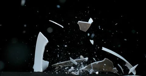 Plate falling and exploding on Black Background Foto stock