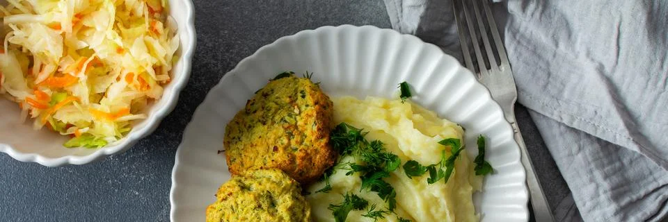 This plate features mashed potatoes, two turkey meatballs, and a side of fe.. Stock Photos