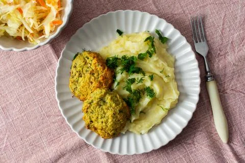 This plate features mashed potatoes, two turkey meatballs, and a side of ferm Stock Photos