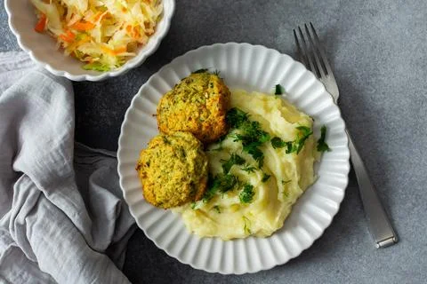 This plate features mashed potatoes, two turkey meatballs, and a side of ferm Stock Photos