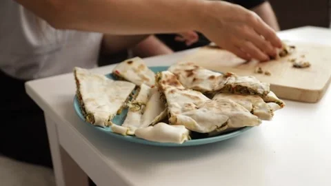 Plate filled with stuffed flatbreads, delicious stuffed bread appetizer for.. Stock Footage 292620005