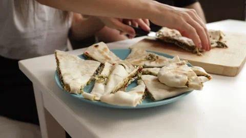 Plate filled with stuffed flatbreads, homemade savory dish perfect for shar.. Stock Footage 290099767