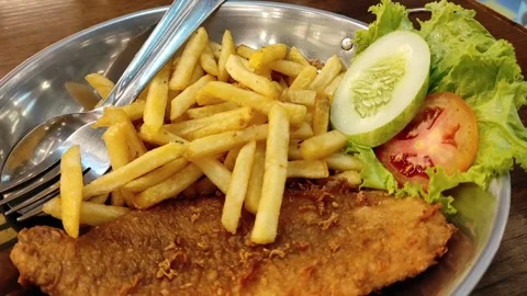 A plate of fish and chips Stock Footage 261154869