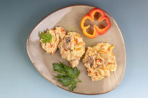 Plate flat lay, holding three mounds of creamy chicken mushroom risotto Stock Photos