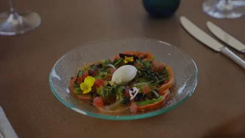 A plate of food with a green leaf on it Stock Footage 306576643
