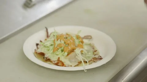 A plate of food on a table Video stock 155454850