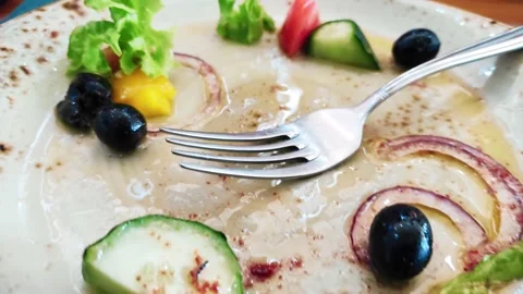 Plate with fork, finished at the restaurant. The camera zooms out of focus. Stock Footage 154757200