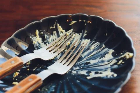 Plate with forks. Rustic breakfast setting scene. Cozy morning meal with Stock Photos