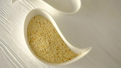 Plate in the form of drops. Dizzy. Yin yang. Sesame and empty. White board backg Stock Footage 147624506