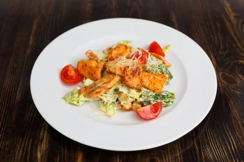 Plate with fresh caesar salad with chicken Фото