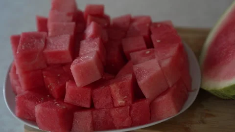 Plate of fresh diced watermelon cubes ready to eat Stock Footage 338120189