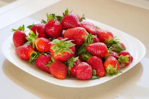 The plate with fresh strawberry Stock Photos