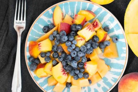 Plate of fresh summer fruit Stock Photos
