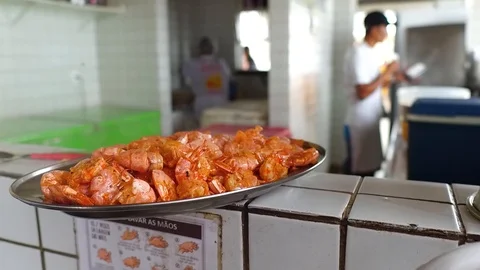 A plate of freshly cooked shellfish sit in a serving window waiting to be Stock Footage 89790700