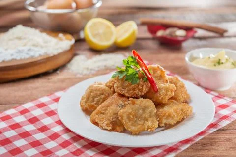 Plate of fried breaded pork on the table in restaurant Stock Photos