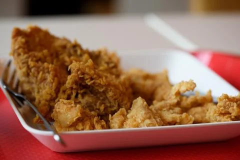 A plate of fried chickens on the table Stock Photos