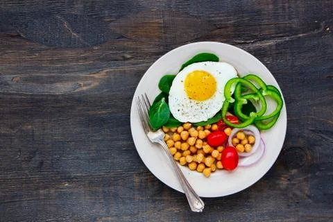 Plate with fried egg Stock Photos