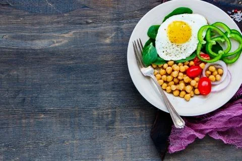 Plate with fried egg Stock Photos