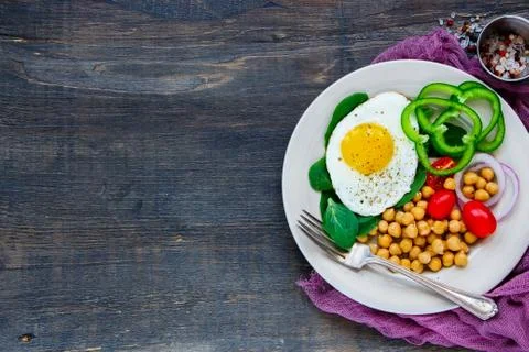 Plate with fried egg Stock Photos