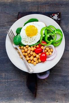 Plate with fried egg Stock Photos