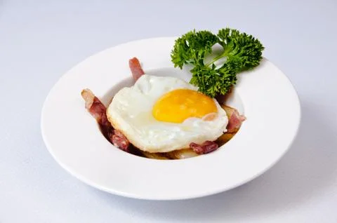 A plate of fried egg on a white background Stock Photos