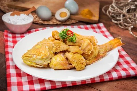Plate of fried fish on the table in restaurant Stock Photos