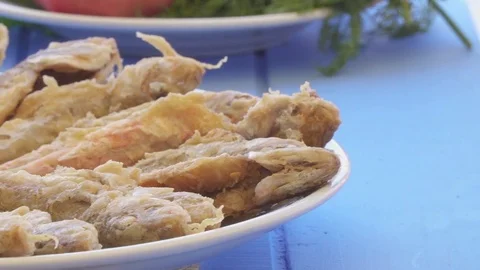 Plate of fried small fish red mullet with arugula and lemon, close up view. Stock Footage 80305821