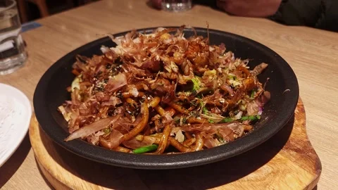Plate of Fried Udon with Waving Bonito Flakes, 4K Video stock 259489595