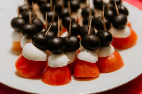 Plate full of appetizers - black, red, white Foto stock