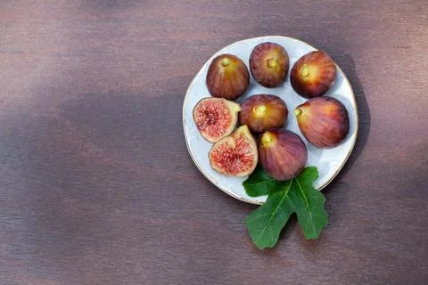 Plate full of figs on a table Stock Photos